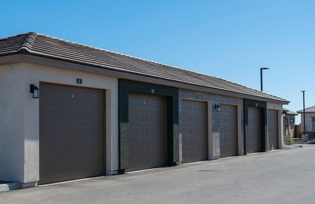 row of garage building on sunny day