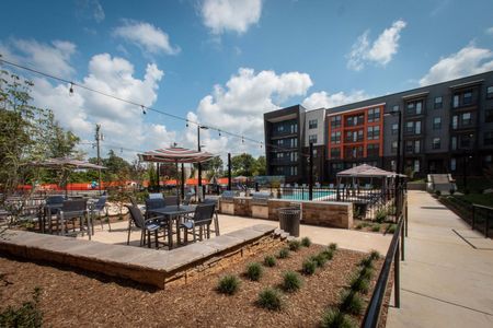 Grill stations in front of community and pool