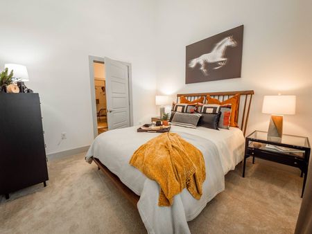 Furnished bedroom with plush carpeting