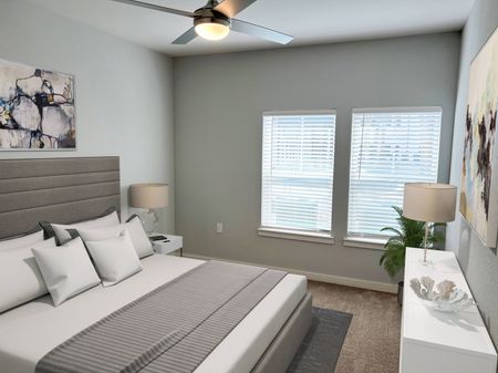 Furnished bedroom with plush carpeting