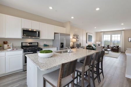 furnished kitchen and living area of townhome