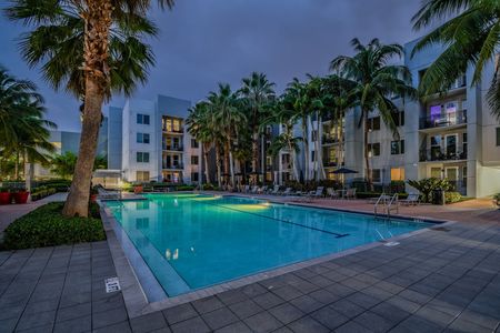 exterior pool and apartment building at nighttime