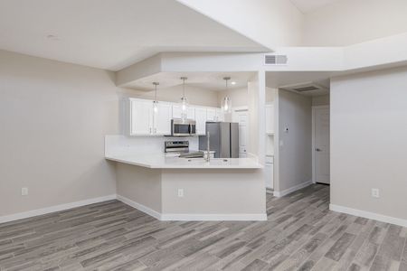 unfurnished kitchen with breakfast bar in apartment home