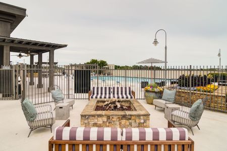 exterior firepit with seating around it on rooftop