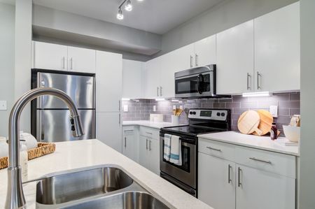 furnished kitchen area in apartment home