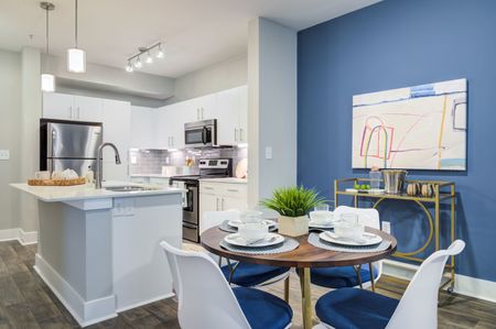 furnished kitchen and dining area in apartment home
