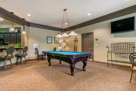 furnished game room with billiards table