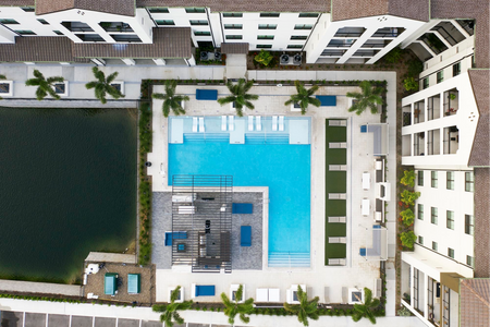 aerial shot of pool and apartment building
