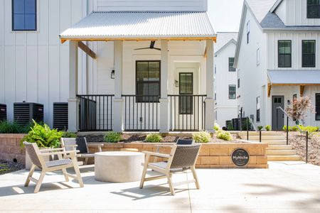 exterior patio set and townhomes on sunny day
