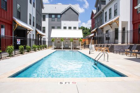 exterior pool and townhomes on sunny day