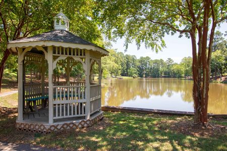 pergola patio area next to lake on sunny day
