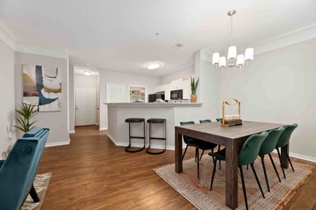 furnished kitchen and dining area of apartment home