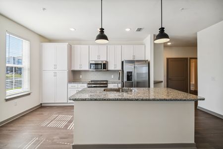 Apartments in Lake Nona for Rent - The Landings at Boggy Creek - Gourmet Kitchen with Designer Finishes, Island, Large Window, and Appliances.