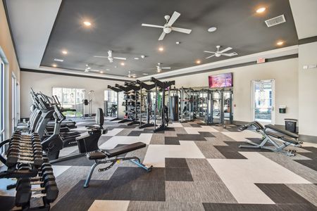 Fitness center with free weights and cardio machines