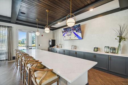clubhouse with tvs and coffee bar and entertaining kitchen