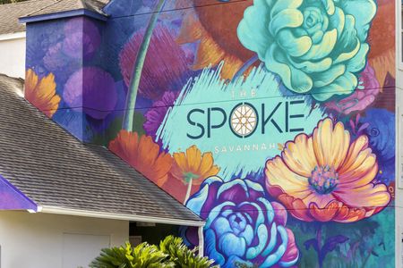 colorful exterior mural for spoke apartment in daytime