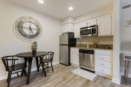 furnished kitchen and dining area in apartment home