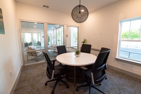 furnished business center with table and seating