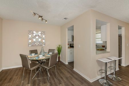 furnished dining and kitchen area in apartment
