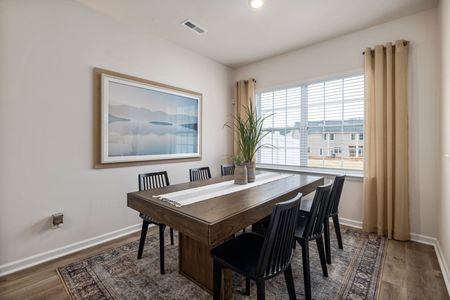furnished dining area with table and chairs in home