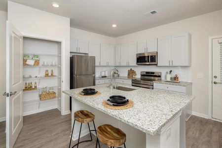 kitchen with white cabinets and pantry