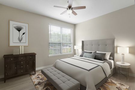 Luxury Apartments In Orlando For Rent - Knightsbridge at Stoneybrook - Spacious Bedroom With Plank Wood-Grain Flooring, High Ceiling, Ceiling Fan, And A Window With Blinds.