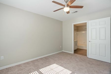 bedroom with carpet and ceiling fan