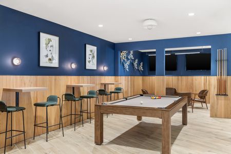 furnished billiards table area with seating