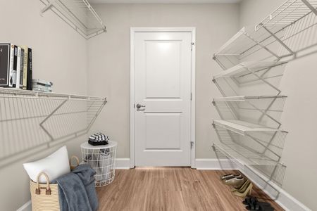 Closet with white vented shelving
