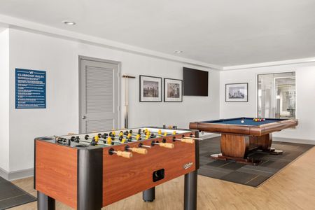 Indoor community area with pool and foosball
