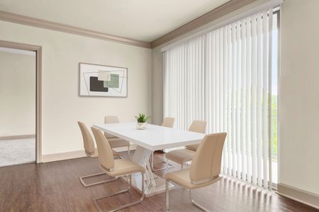 Virtually staged furnished dining room with table and chairs