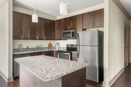 Virtually staged furnished kitchen with large island