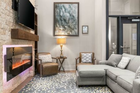 Furnished clubroom with couch and chairs
