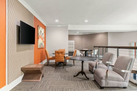 Furnished clubroom with tables and chairs