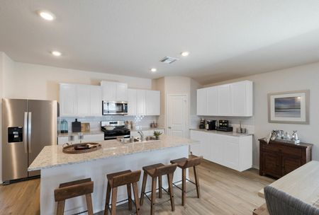 furnished kitchen with kitchen island in home
