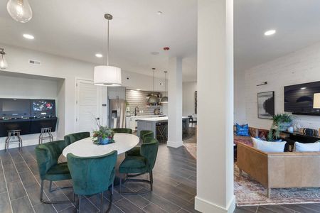 furnished clubhouse area with seating and privacy rooms