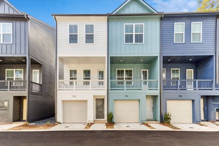 row of townhomes with garages in daytime