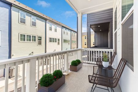 furnished balcony overlooking at townhomes in daytime