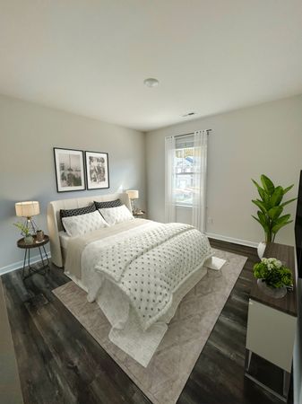 Furnished bedroom in the Mitchell Floor Plan