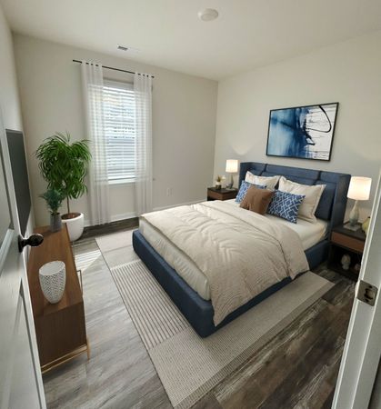 Furnished bedroom in the Mitchell Floor Plan