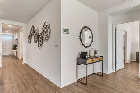 Entryway of home with wall decor and console table