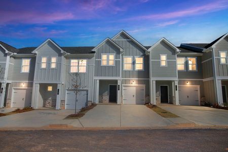 Townhome exterior at dusk
