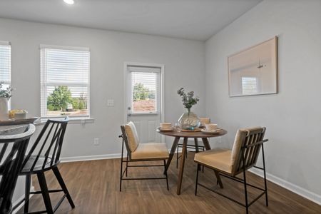 Furnished dining area with windows