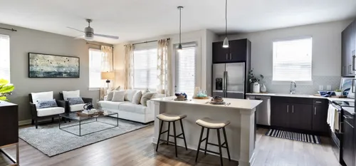 furnished kitchen and living area of apartment home