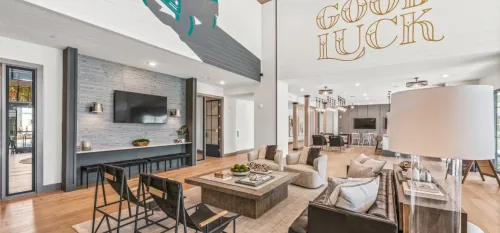 furnished clubroom with seating and television