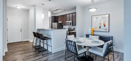 kitchen with bar top and dining area