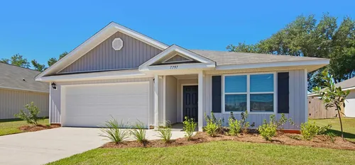 Exterior single-family, single-story home with plants out front in daytime