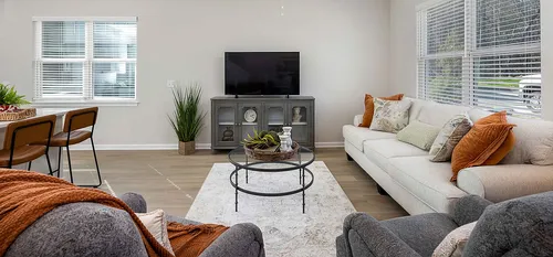 Living room with couch and chairs