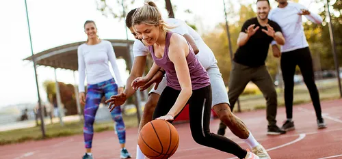 Friends playing basketball