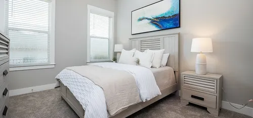 Furnished living room with bed and side table